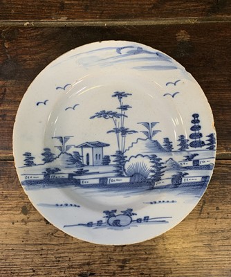 Lot 42 - An 18th century English Delft plate, decorated...