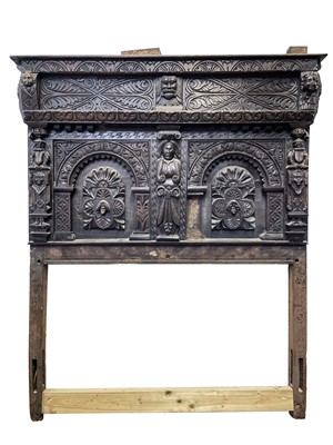 Lot 120 - A carved oak bedhead, early 17th century, with...