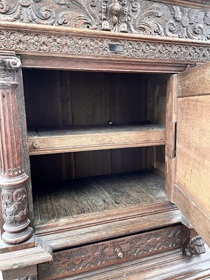 Lot 121 - A Flemish carved oak cabinet on stand, 17th...