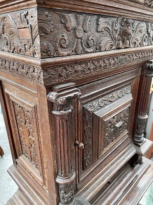 Lot 121 - A Flemish carved oak cabinet on stand, 17th...