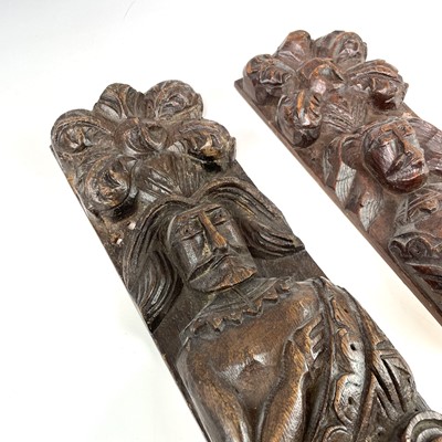 Lot 124 - A pair of 17th Century oak panels carved with...