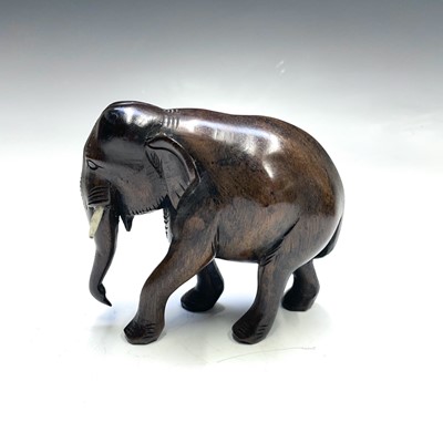 Lot 207 - An African carved ironwood rhino together with...