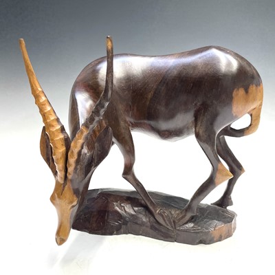 Lot 207 - An African carved ironwood rhino together with...