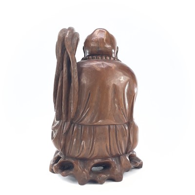 Lot 279 - A large Chinese carved wood model of buddah,...