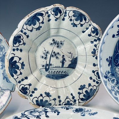 Lot 34 - Seven Delft blue and white plates and a lobed...