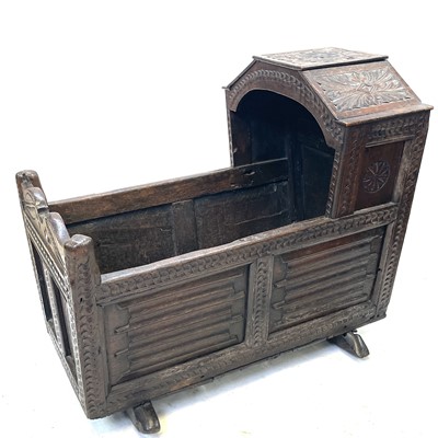 Lot 60 - A carved oak crib, 17th/18th century, height...