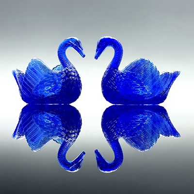 Lot 911 - Two Burtles, Tate & Co blue glass swan salts,...