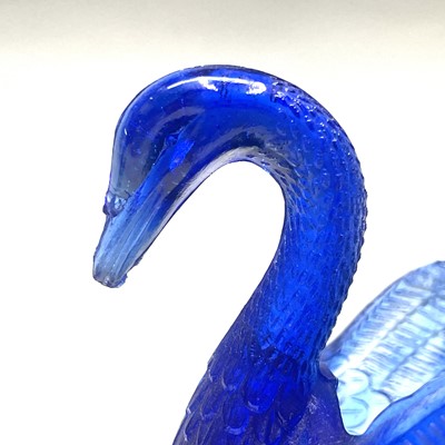 Lot 911 - Two Burtles, Tate & Co blue glass swan salts,...