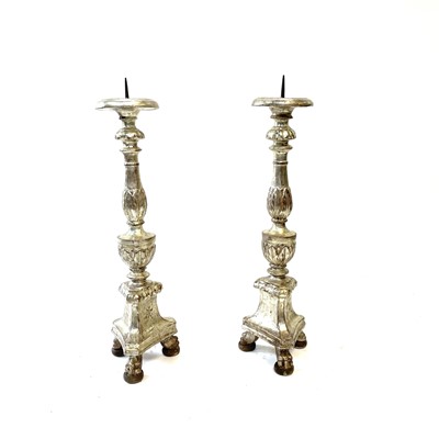 Lot 116 - A pair of Italian silvered carved wood candle...