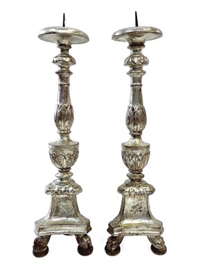 Lot 22 - A pair of Italian silvered carved wood candle stands, circa 1700-1750.