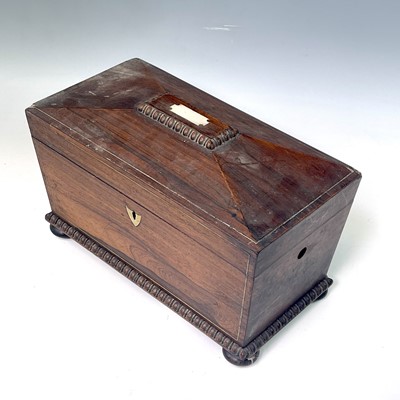 Lot 12 - A Regency rosewood tea caddy, of sarcophagus...