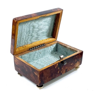 Lot 282 - A 19th century silver inlaid hinge lidded...