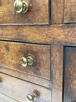 Lot 67 - A George III oak dresser, the rack with three...