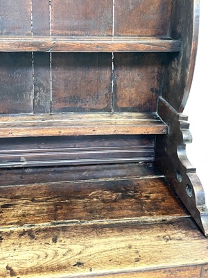 Lot 67 - A George III oak dresser, the rack with three...