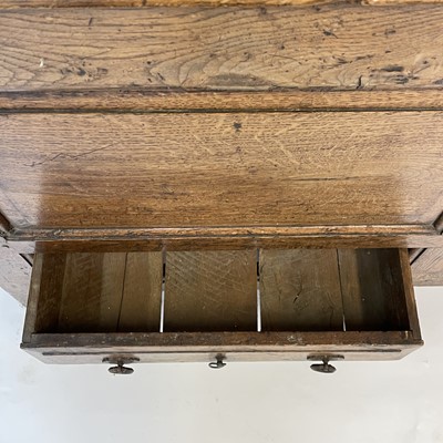 Lot 78 - A George III oak press cupboard, with a pair...