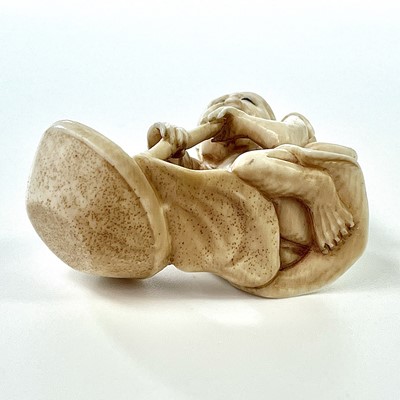 Lot 258 - A Japanese Meiji period carved ivory okimono...