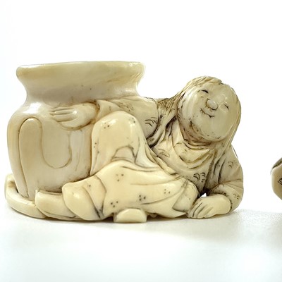 Lot 230 - A Japanese Meiji period carved ivory netsuke...