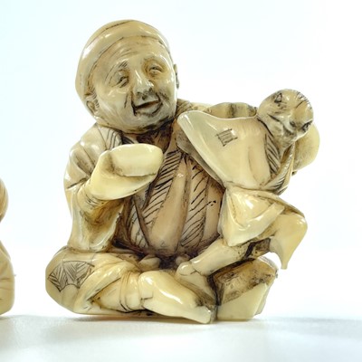 Lot 230 - A Japanese Meiji period carved ivory netsuke...