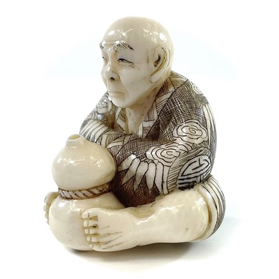Lot 271 - A Japanese Meiji period carved ivory netsuke...