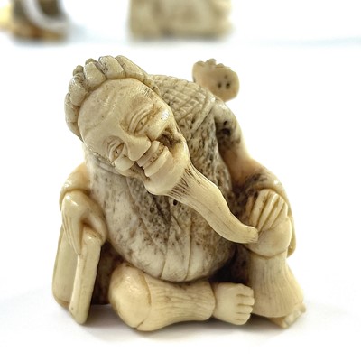 Lot 238 - A Japanese Meiji period carved ivory okimono...