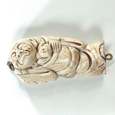 Lot 238 - A Japanese Meiji period carved ivory okimono...