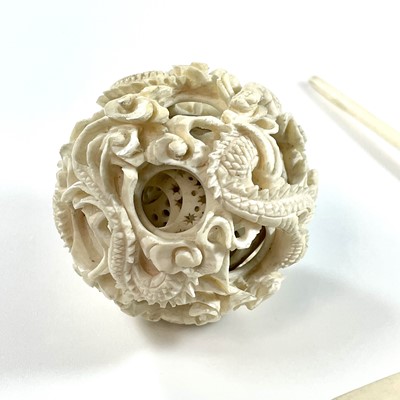 Lot 211 - A 19th century Chinese ivory concentric ball,...
