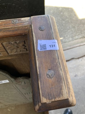 Lot 131 - A 1930's oak bench settle, the raised panel...