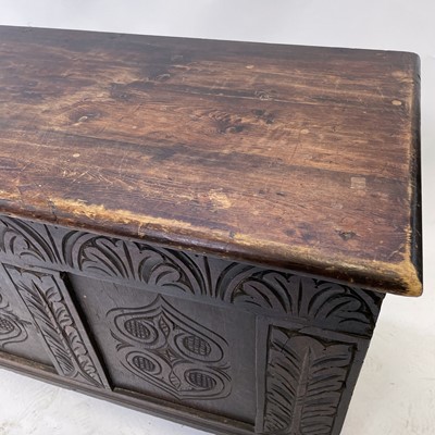Lot 134 - An oak and pine coffer with carved triple...