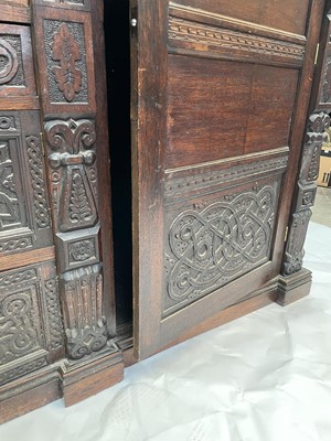 Lot 148 - A carved oak wardrobe, early 20th century,...