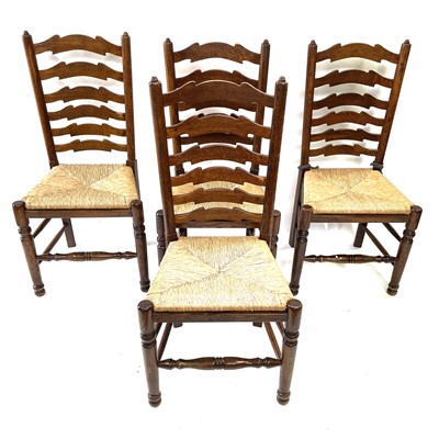 Lot 143 - A set of four ash and elm ladderback dining...