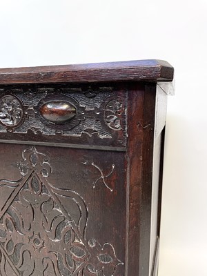 Lot 147 - A late 19th century carved oak blanket chest,...