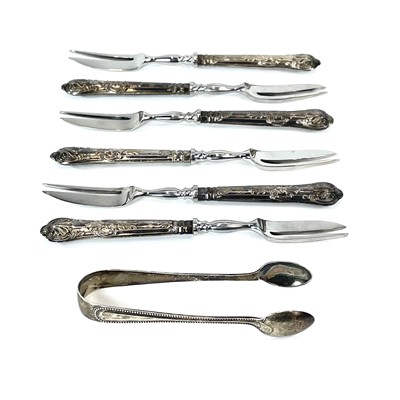 Lot 58 - A cased set of six cake forks with silver...