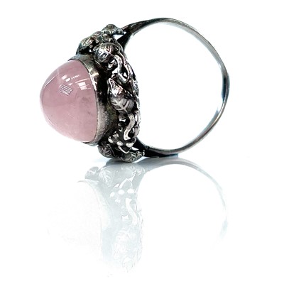 Lot 142 - A silver Arts & Crafts rose quartz set ring,...