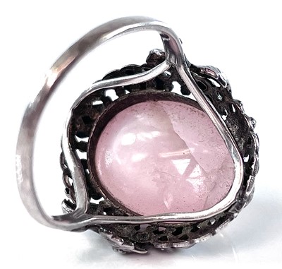 Lot 142 - A silver Arts & Crafts rose quartz set ring,...