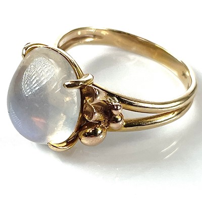 Lot 211 - A stylish 14K moonstone set cocktail ring, the...