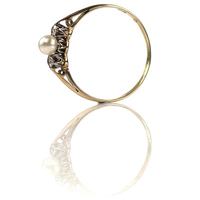Lot 24 - An 18ct diamond and pearl set three stone ring,...