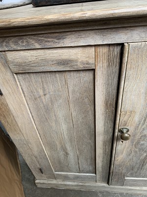 Lot 164 - A large ash cupboard, with four panelled doors...