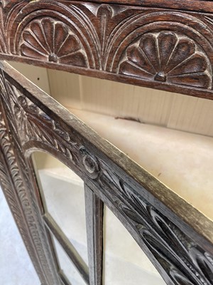 Lot 186 - A 19th century carved oak bookcase, with a...