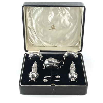 Lot 147 - A cased George V silver five piece cruet set...