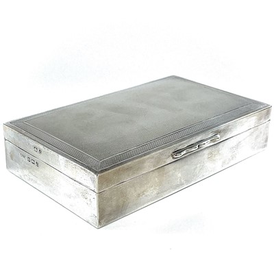 Lot 124 - A modern silver engine turned cigarette box by...
