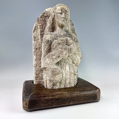 Lot 250 - A medieval carved stone figure, with arms...