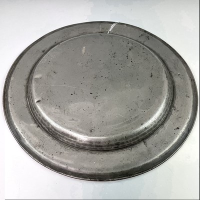 Lot 125 - An 18th century pewter charger, diameter 38cm.