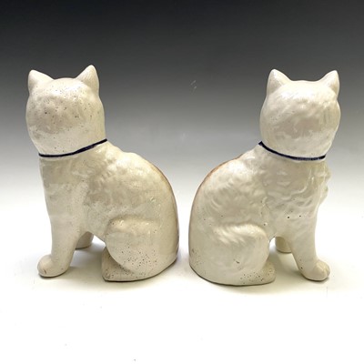 Lot 224 - A pair of Staffordshire type models of cats,...