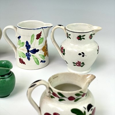 Lot 247 - Seven miniature pearlware and creamware jugs,...
