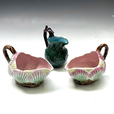 Lot 824 - A small green glazed majolica cream jug,...