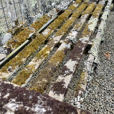 Lot 603 - A teak slatted Garden bench height 83cm width...