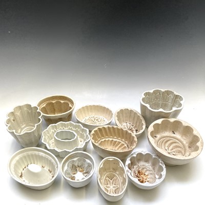 Lot 264 - Twelve pottery jelly moulds, including one...