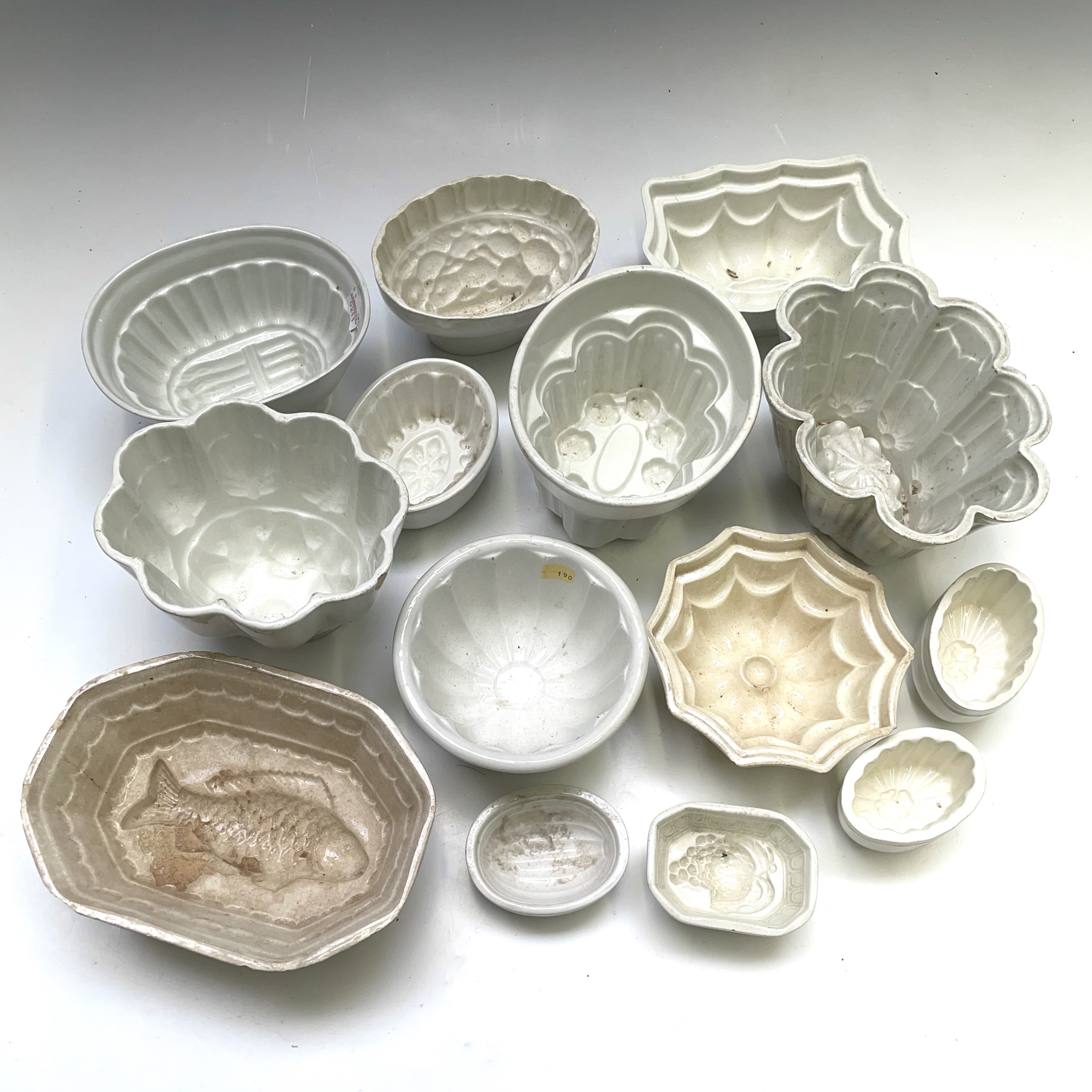 Lot 265 Fourteen pottery jelly moulds, including one