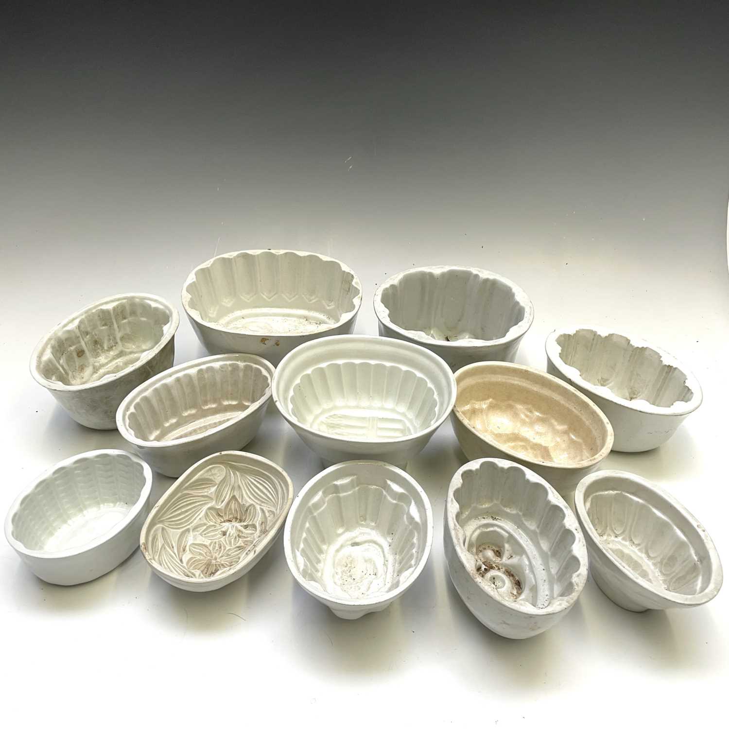 Lot 267 - Twelve pottery jelly moulds. (12)