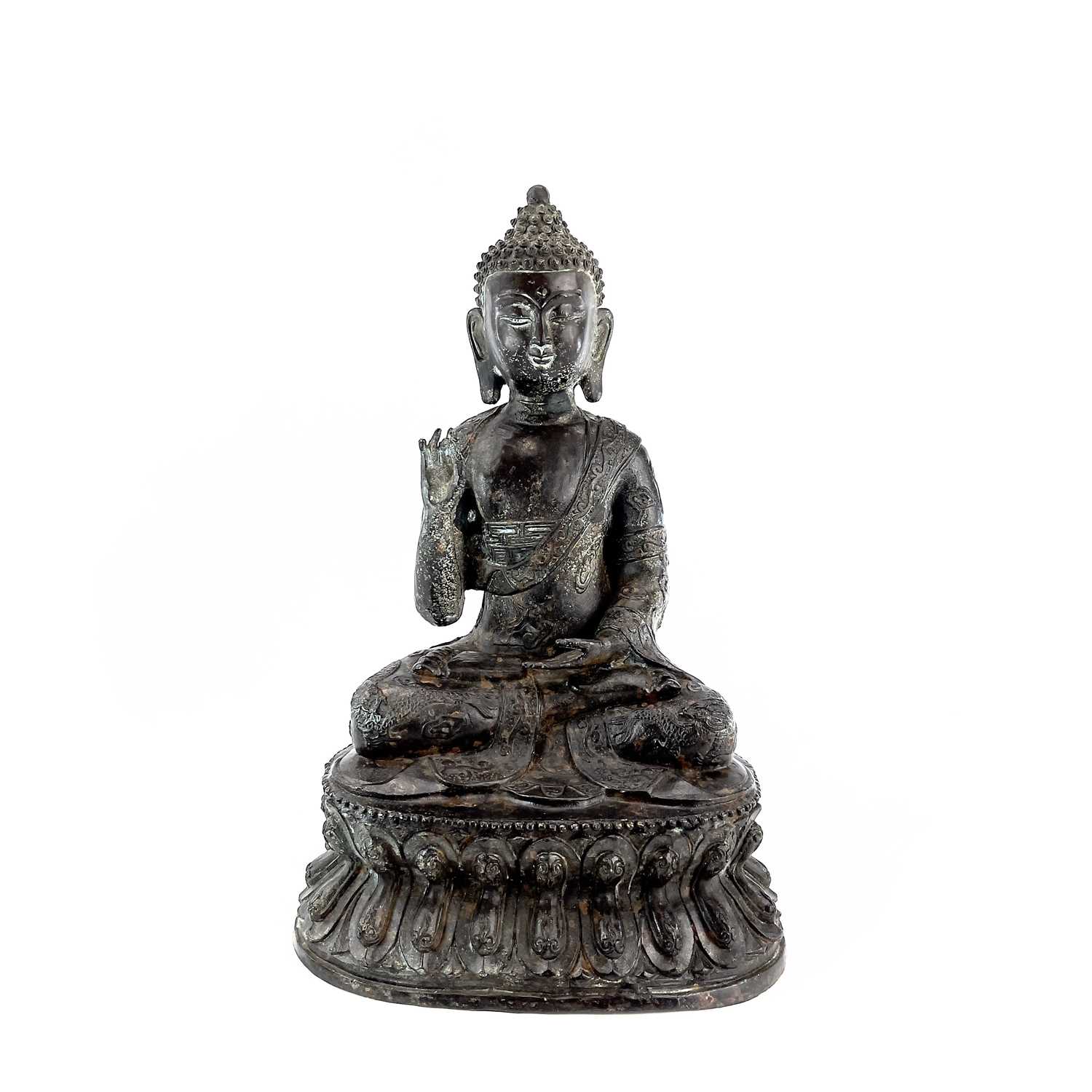 Lot 60 - A Chinese bronze model of a seated buddha,...